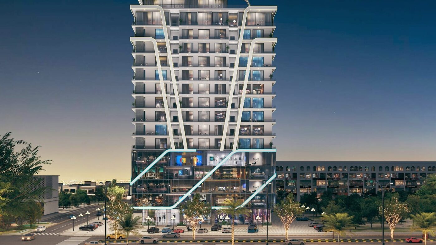 Front view of Bahria Sky 2 high-rise building in Bahria Orchard Phase 4, featuring modern architecture with luxury apartments, commercial outlets, and illuminated exterior design at night.